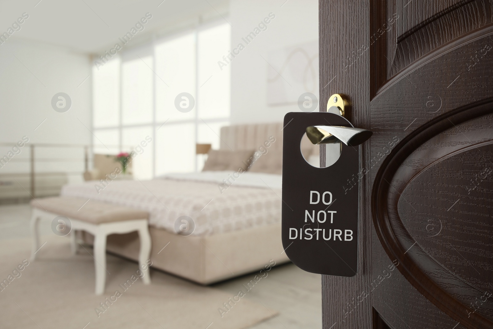 Image of Wooden door open into modern hotel room, closeup