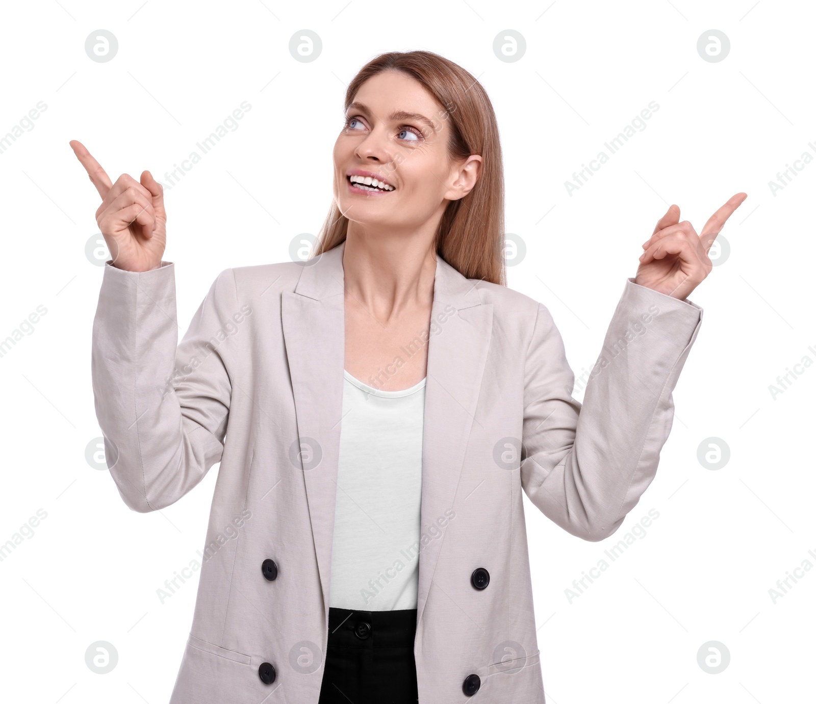 Photo of Beautiful happy businesswoman pointing at something on white background