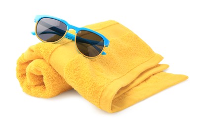 Photo of Yellow terry towel and sunglasses isolated on white. Beach objects