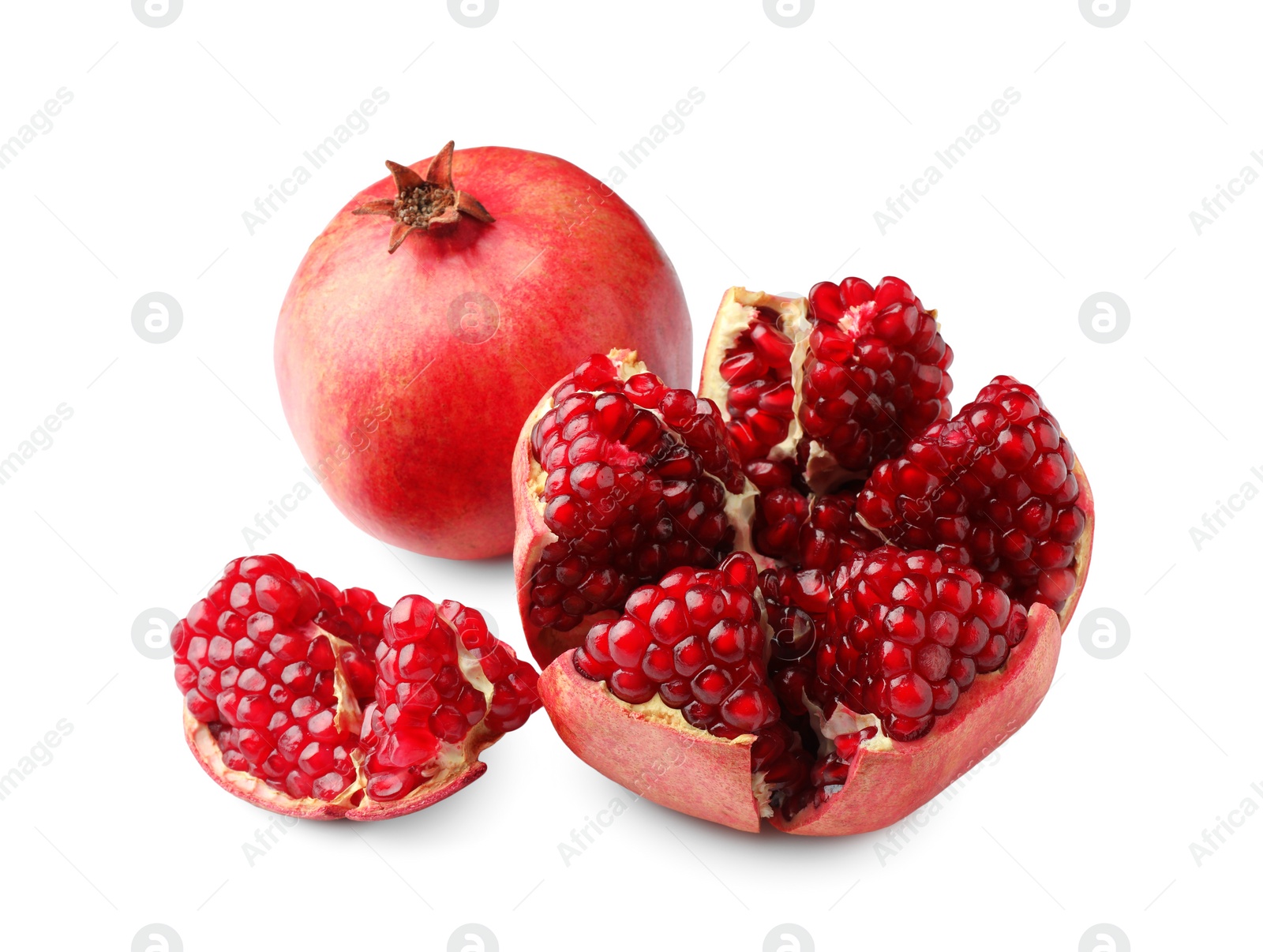 Photo of Whole and cut fresh pomegranates isolated on white