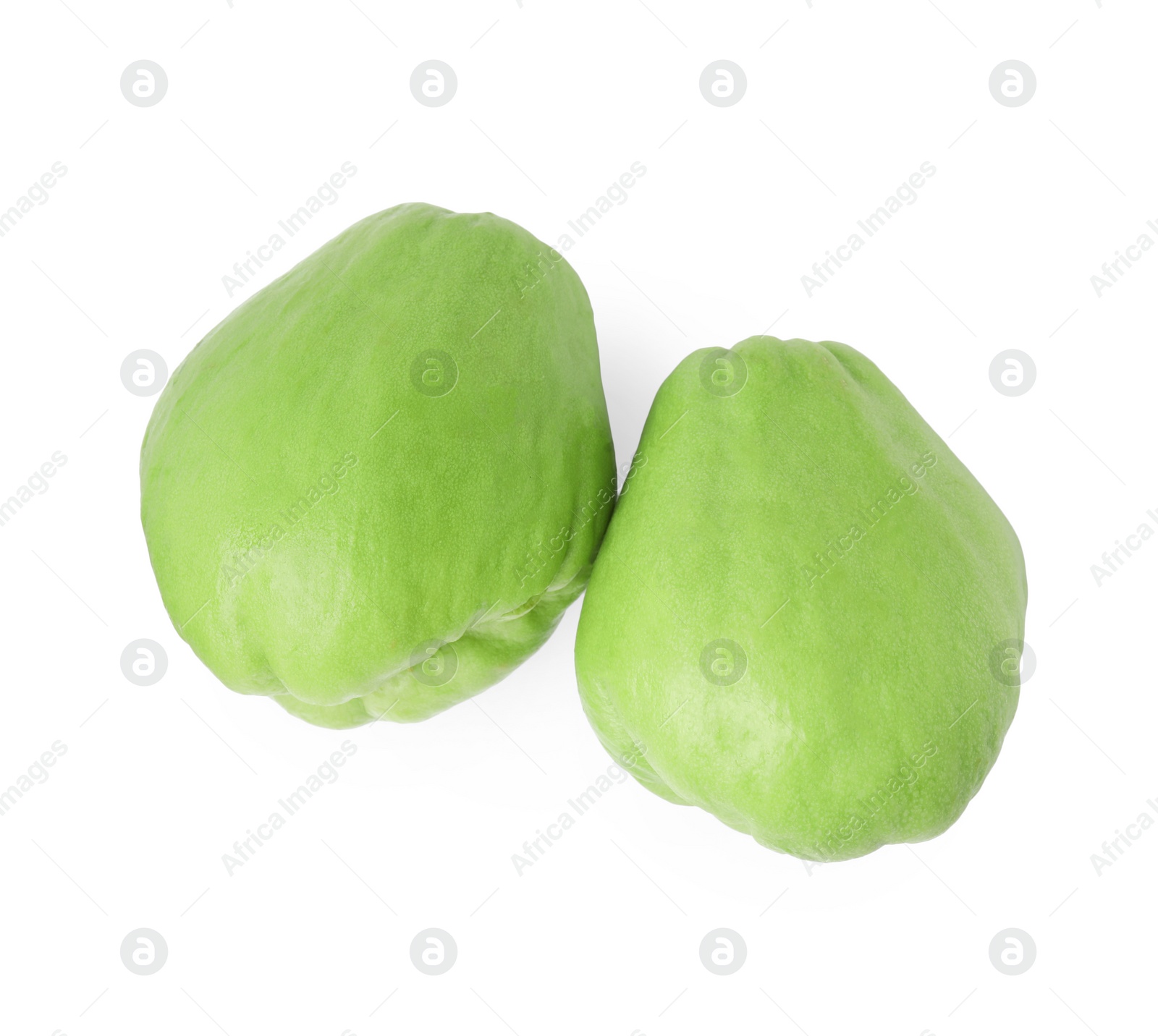 Photo of Two fresh green chayote isolated on white, top view