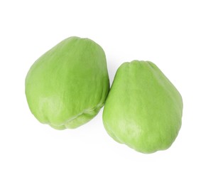 Two fresh green chayote isolated on white, top view