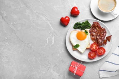 Photo of Romantic breakfast on grey table, flat lay with space for text. Valentine's day celebration