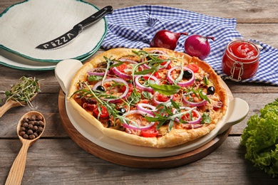 Tasty fresh homemade pizza on wooden table