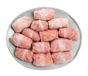 Photo of Uncooked stuffed cabbage rolls on white background, top view