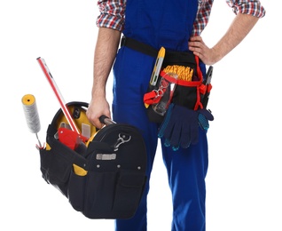 Photo of Construction worker with set of tools on white background, closeup