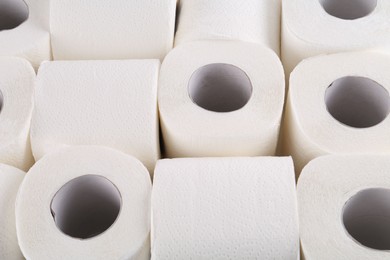 Photo of Many soft toilet paper rolls as background, above view