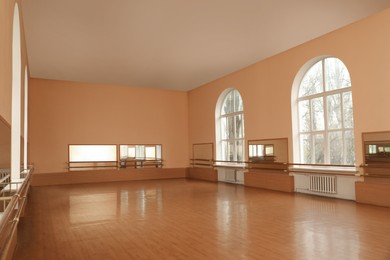 Photo of View of empty studio with mirrors and ballet barres
