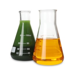 Photo of Two flasks with different types of crude oil isolated on white