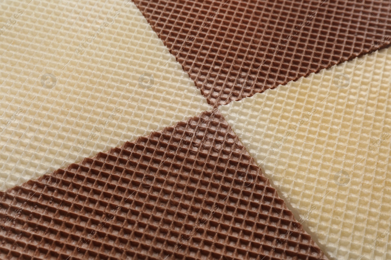 Photo of Tasty wafers as background, closeup. Crispy food