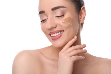 Photo of Woman with swatches of foundation on face against white background