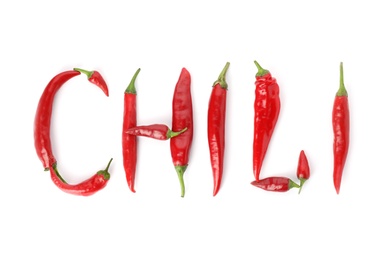 Photo of Word CHILI made with red hot peppers on white background, top view