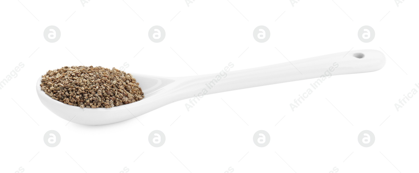 Photo of Spoon of celery seeds isolated on white