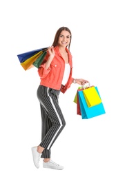 Photo of Young woman with shopping bags on white background