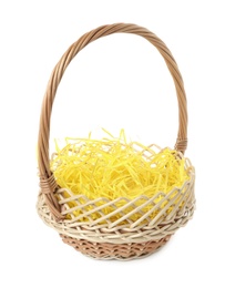 Wicker basket with yellow filler isolated on white. Easter item