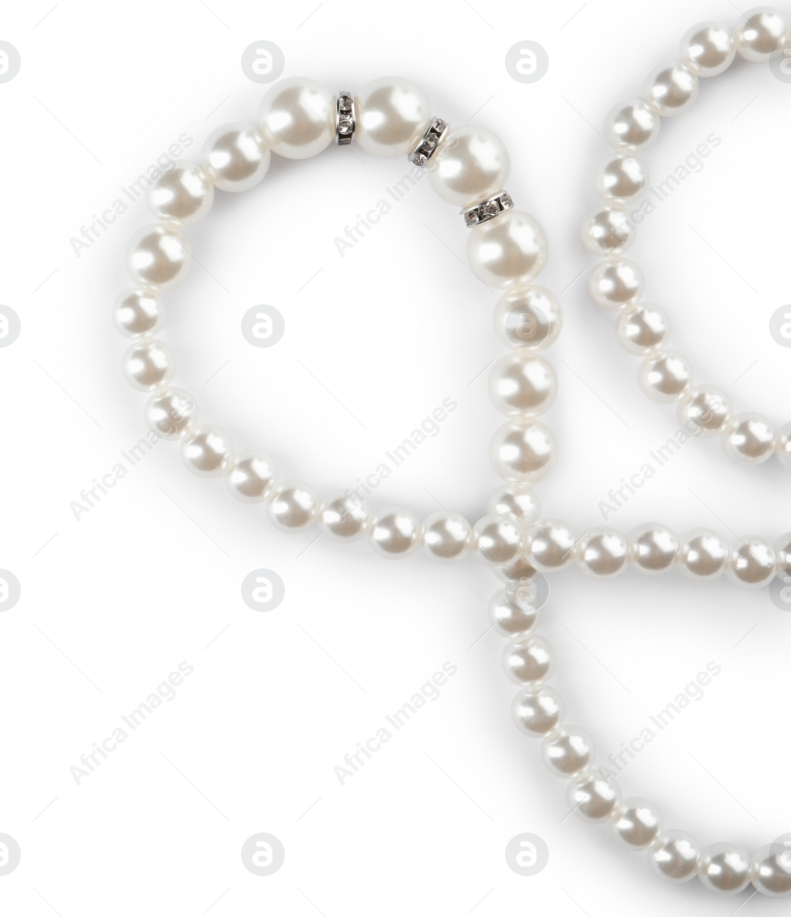 Photo of Elegant pearl necklace isolated on white, top view