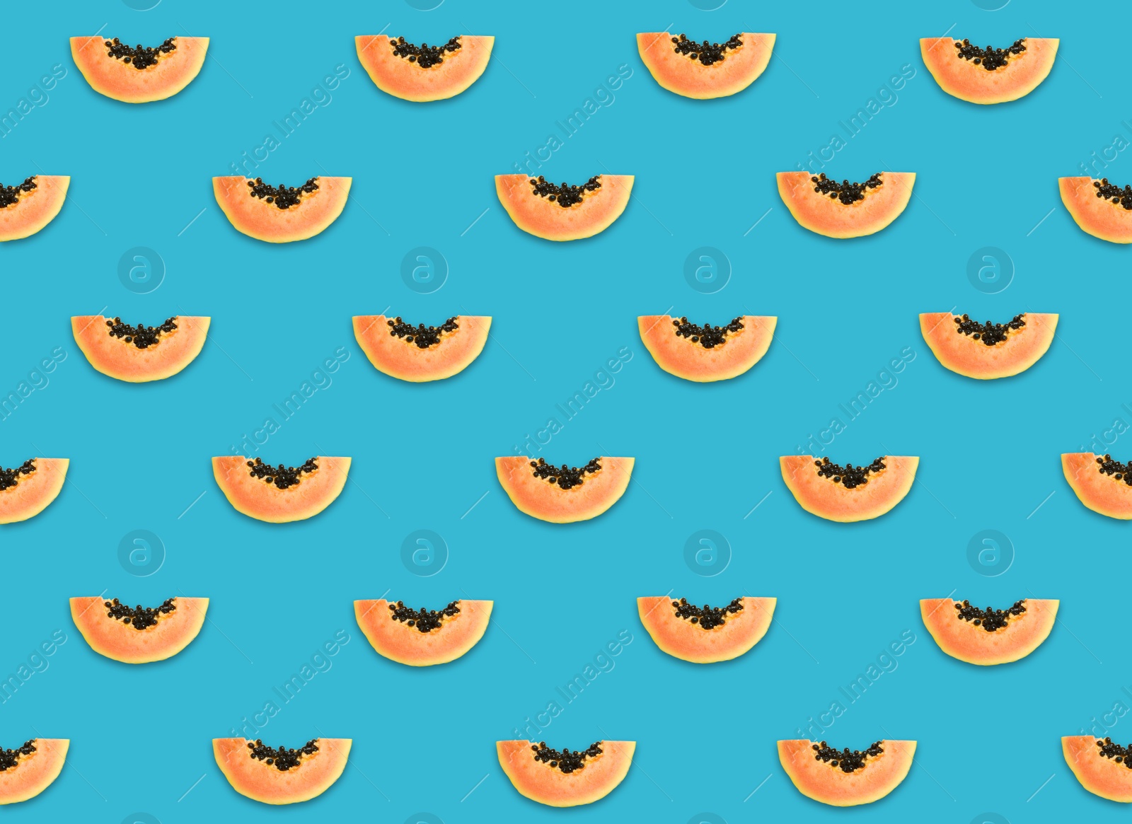 Image of Pattern of papaya slices on blue background