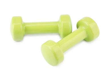 Photo of Light green dumbbells isolated on white. Sports equipment