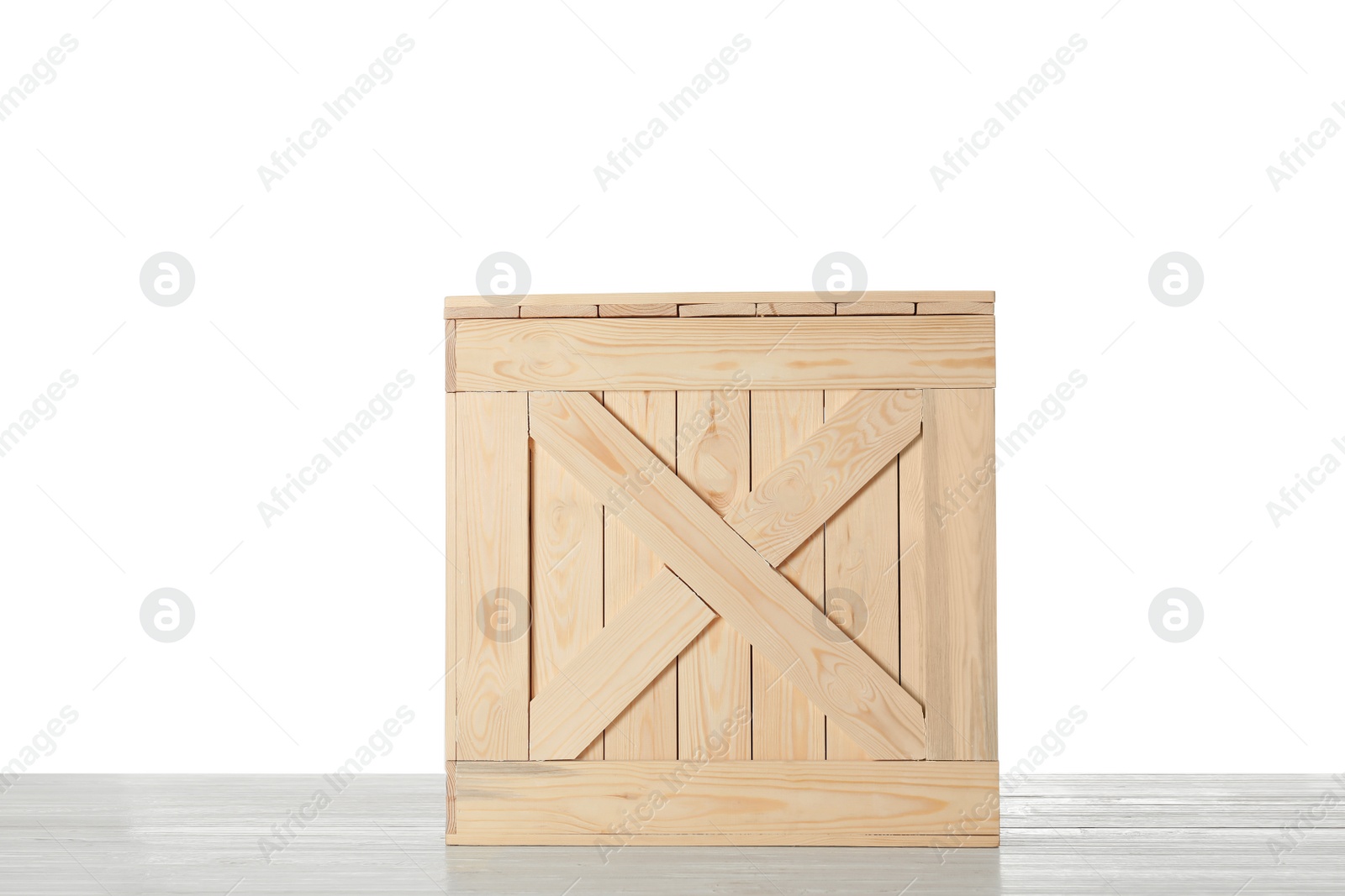 Photo of Wooden crate on table against white background