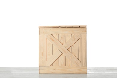 Photo of Wooden crate on table against white background