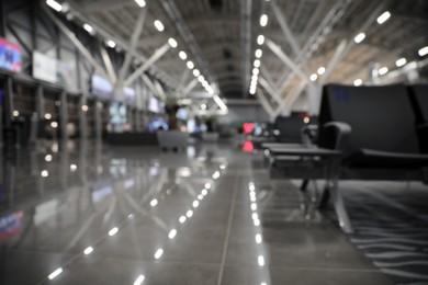 Photo of Blurred view of waiting area in airport terminal