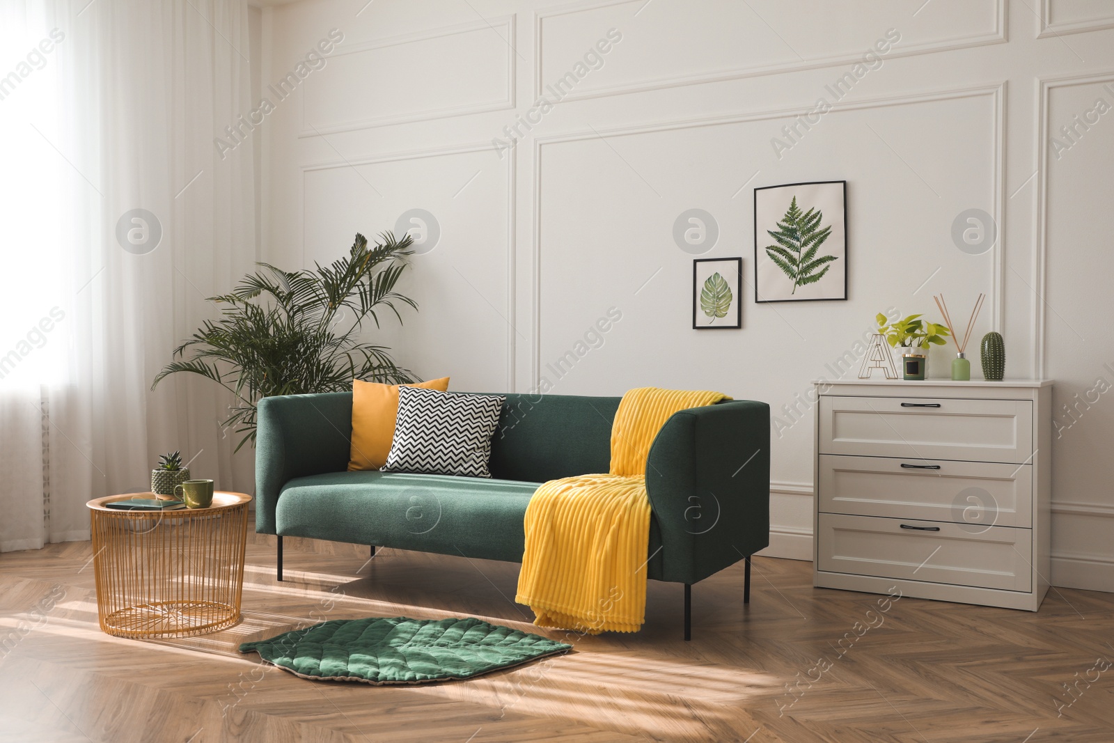 Photo of Stylish living room interior with comfortable green sofa