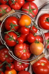 Photo of Many different ripe tomatoes on table, flat lay