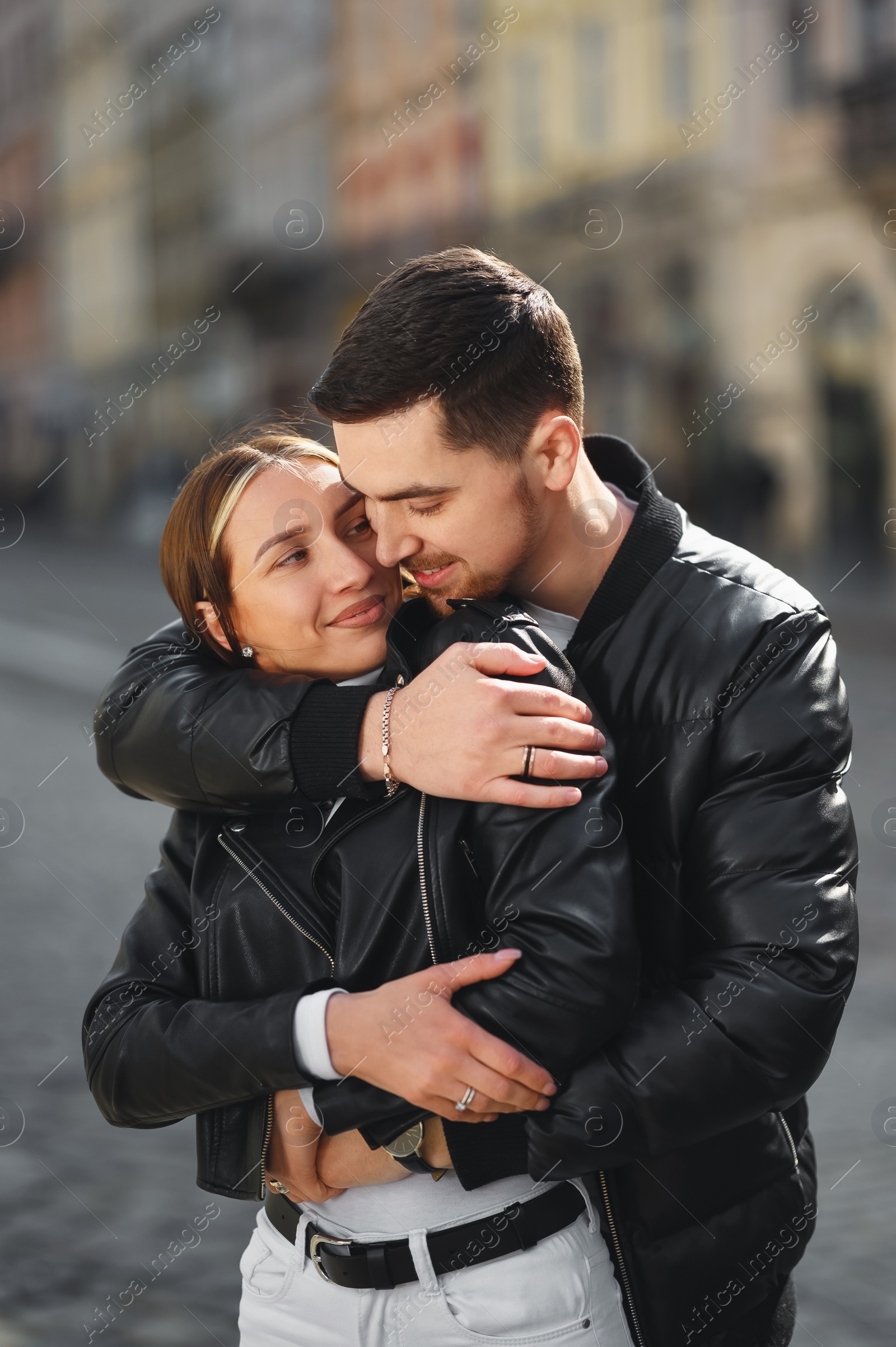 Photo of Lovely young couple together on city street. Romantic date