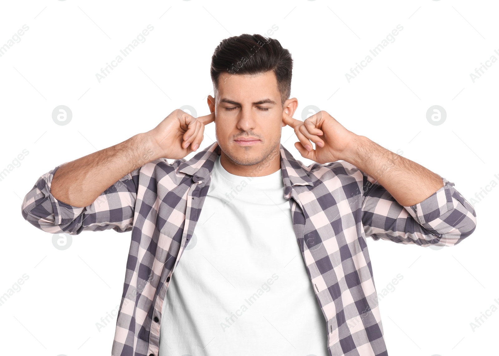 Photo of Man covering ears with fingers on white background