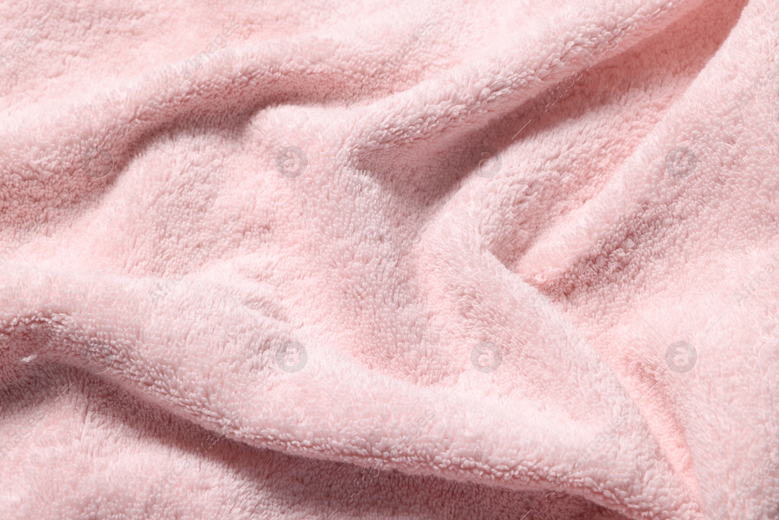 Photo of Texture of pink crumpled fabric as background, top view