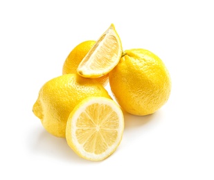 Photo of Ripe whole and sliced lemons on white background