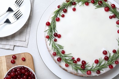Photo of Flat lay composition with traditional Christmas cake on light grey marble table