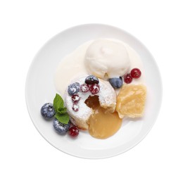 Photo of Tasty vanilla fondant with white chocolate, berries and ice cream isolated on white, top view