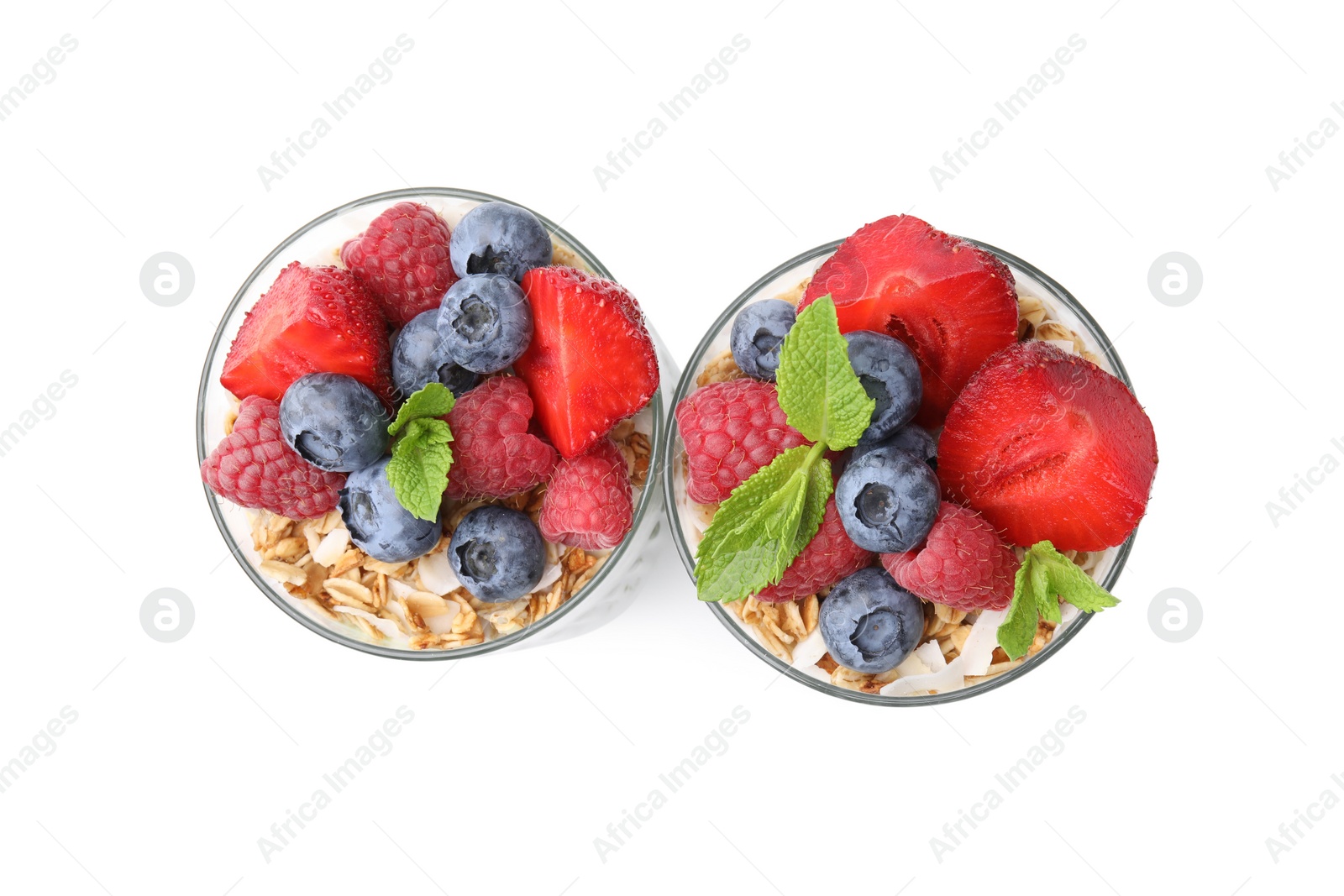 Photo of Tasty oatmeal with smoothie, berries and mint on white background, top view. Healthy breakfast