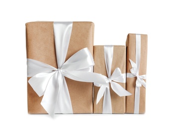 Photo of Beautifully wrapped gift boxes on white background