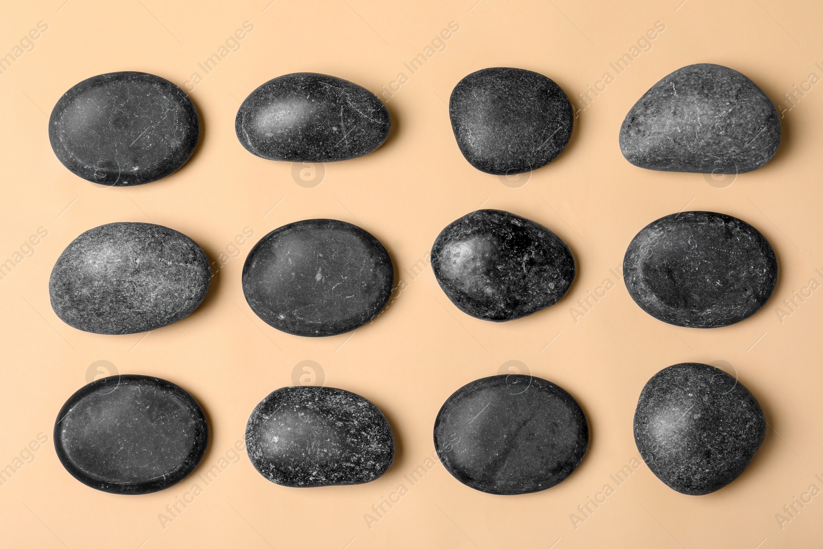 Photo of Spa stones on color background, flat lay