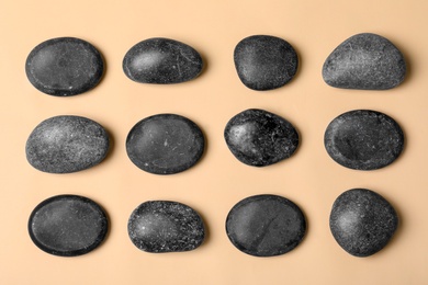 Photo of Spa stones on color background, flat lay