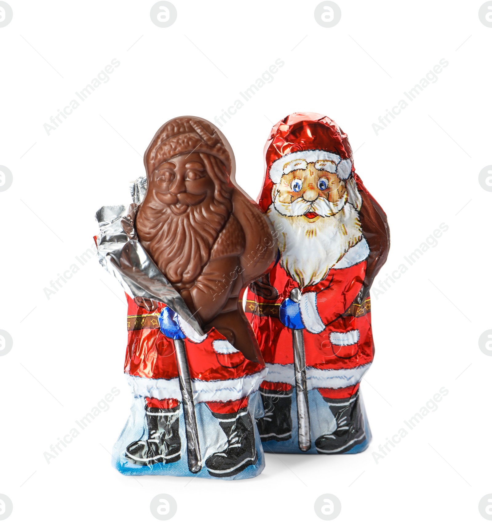 Photo of Sweet chocolate Santa Claus candies in foil wrappers on white background