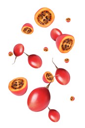 Delicious exotic tamarillo fruits flying on white background