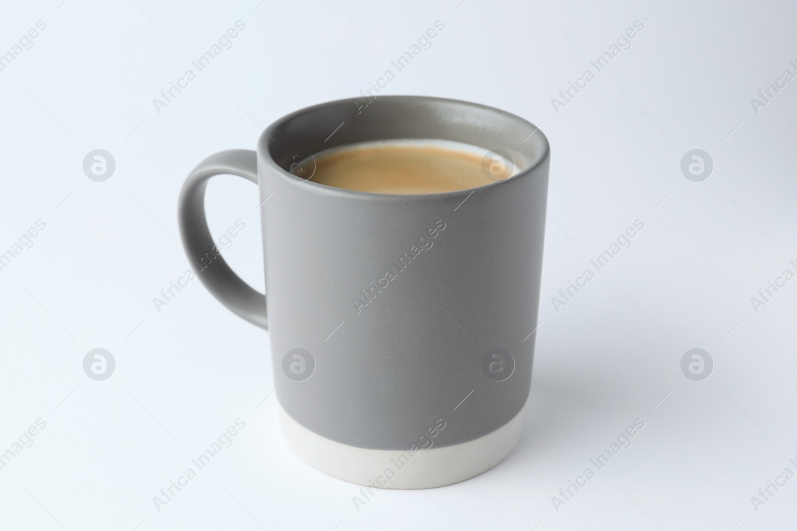 Photo of Grey mug of freshly brewed hot coffee on white background