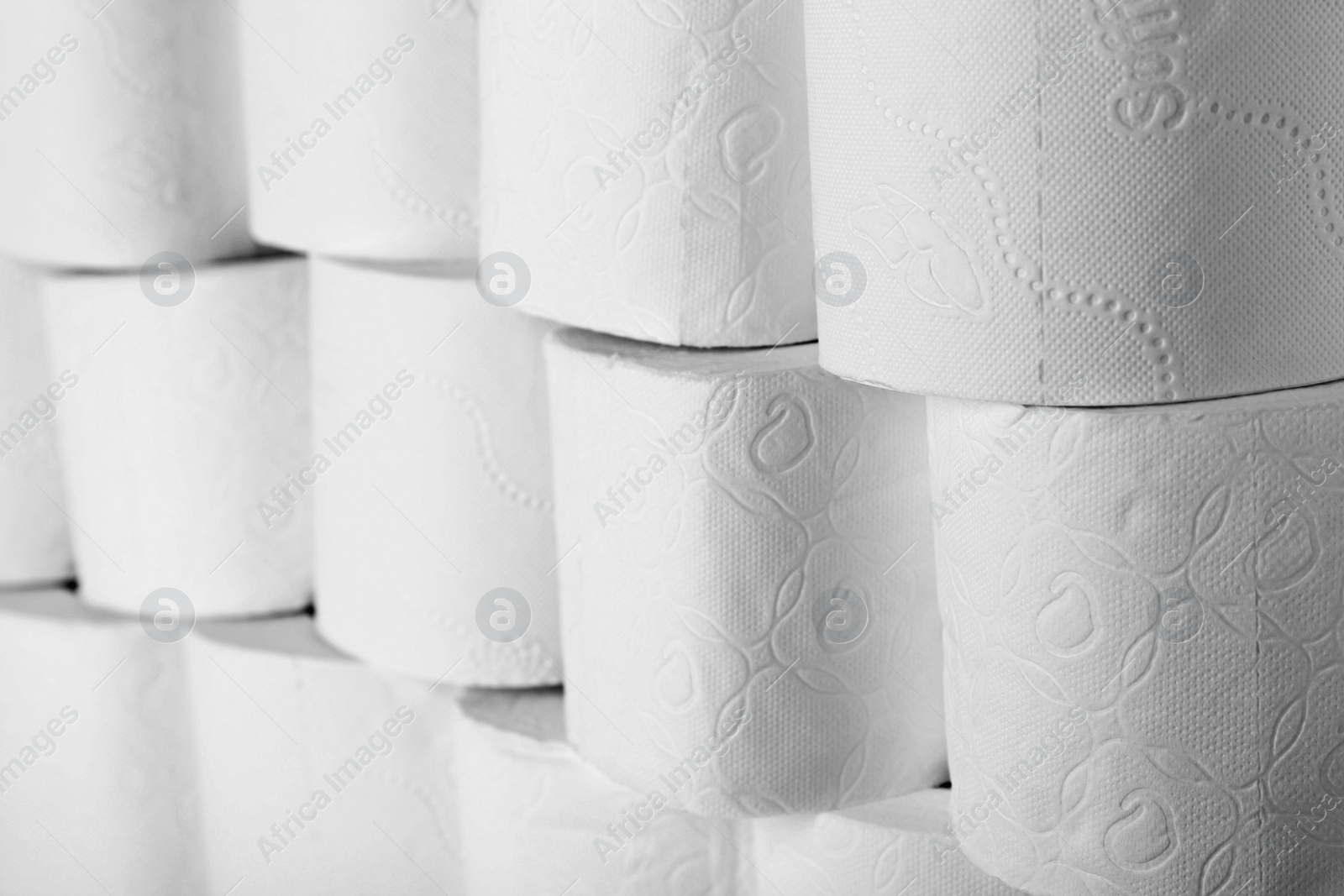 Photo of Many rolls of toilet paper as background. Personal hygiene