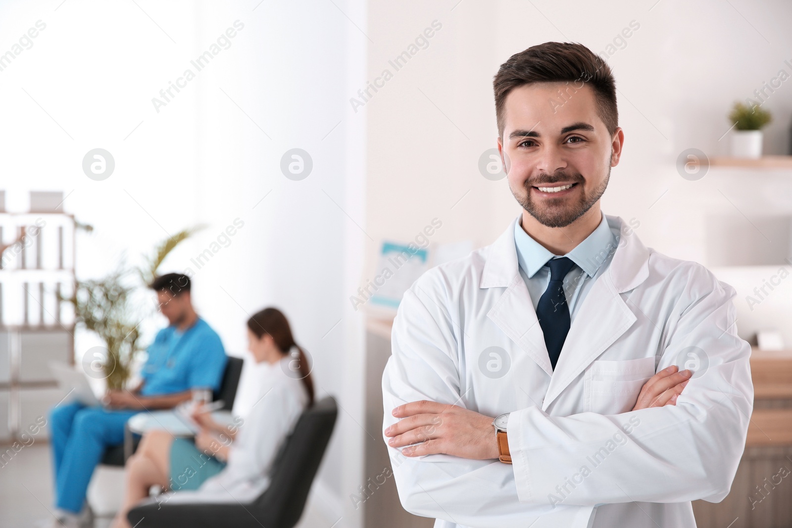 Photo of Portrait of male doctor in modern clinic