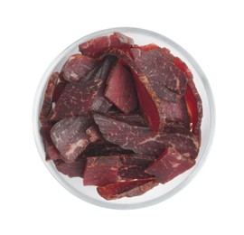 Bowl of delicious beef jerky isolated on white, top view