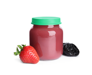 Photo of Jar with baby food, strawberry and dried plum on white background