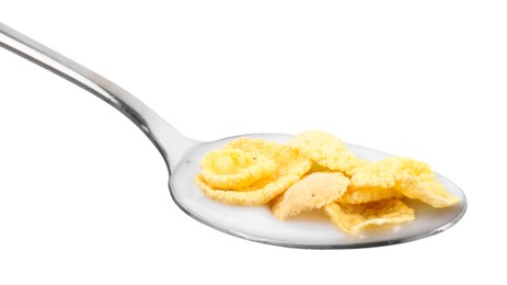 Photo of Breakfast cereal. Corn flakes and milk in spoon isolated on white