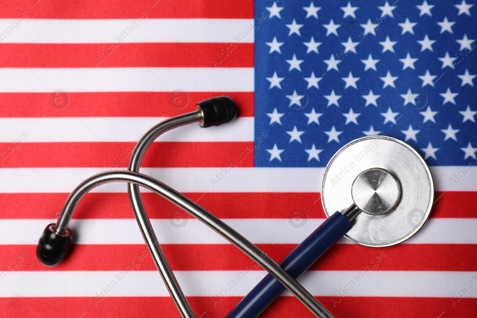 Photo of Stethoscope on USA flag, top view. Health care concept