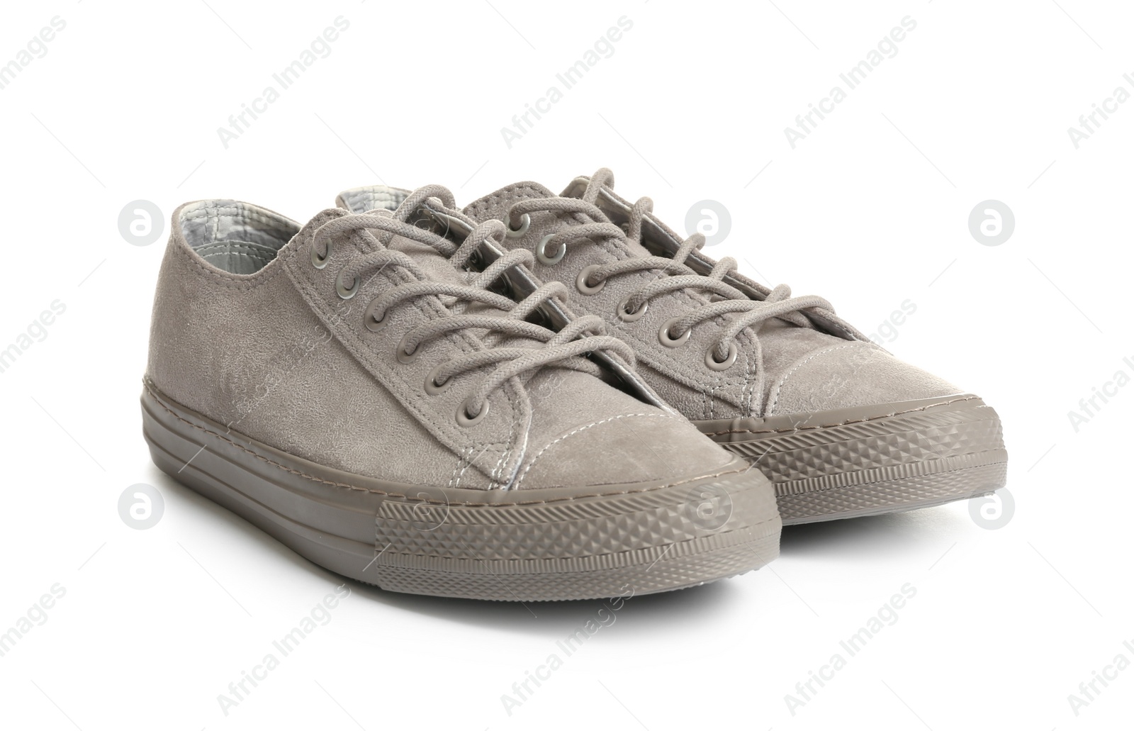 Photo of Pair of stylish sneakers on white background