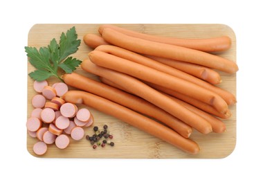 Photo of Fresh raw sausages, parsley and spices isolated on white, top view. Meat product