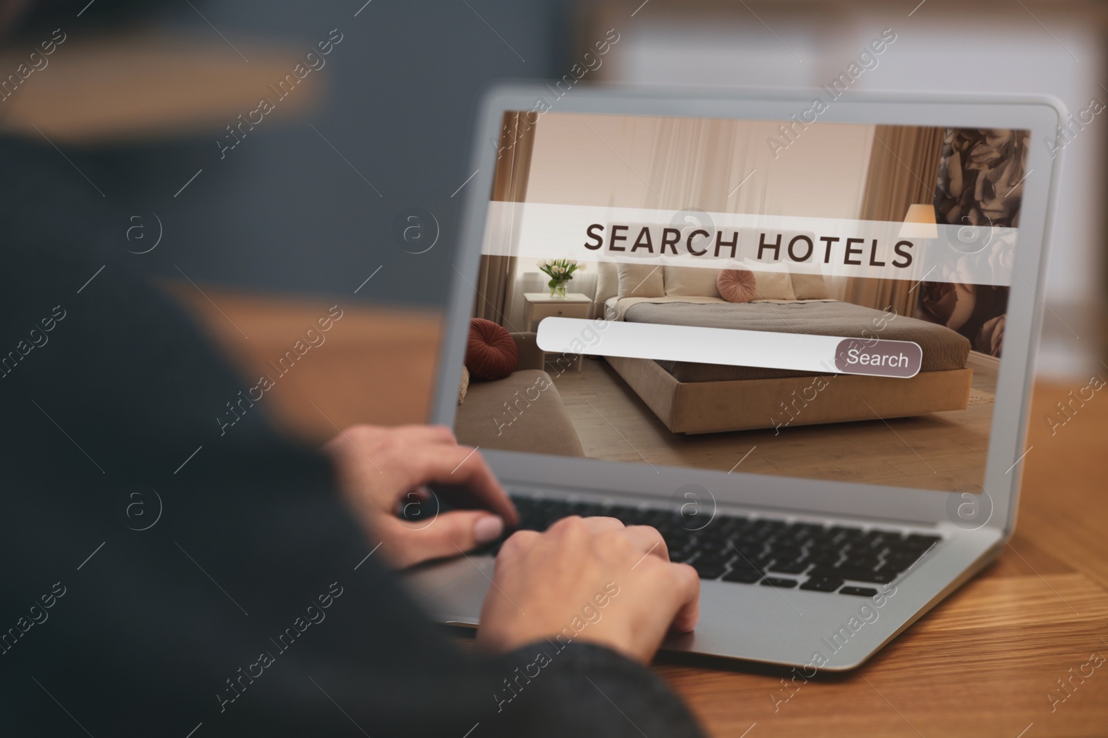 Image of Woman searching hotel using laptop at table, closeup. Booking online service