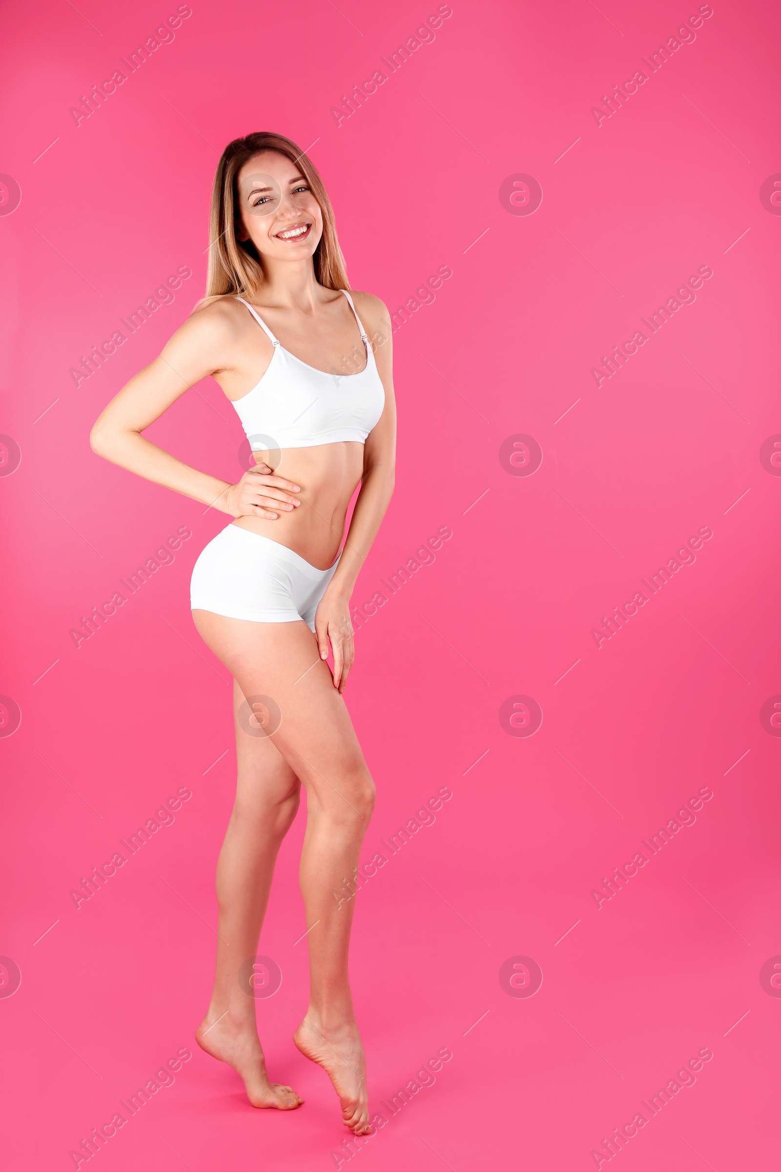 Photo of Young slim woman on color background, space for text. Perfect body